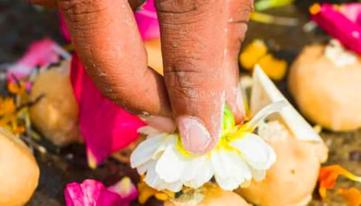 Pitru Dosh Puja: The yajman places flowers on the pinda offering at Godavari River bank, Trimbakeshwar